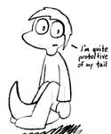 Tyler sitting, with his tail curled in front of him, saying he's quite protective of it