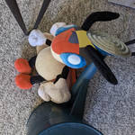 A photo of a plush toy of the Pokémon Ledian, with the colors changed and a hat drawn on to resemble the protagonist of Pokemon Gold and Silver