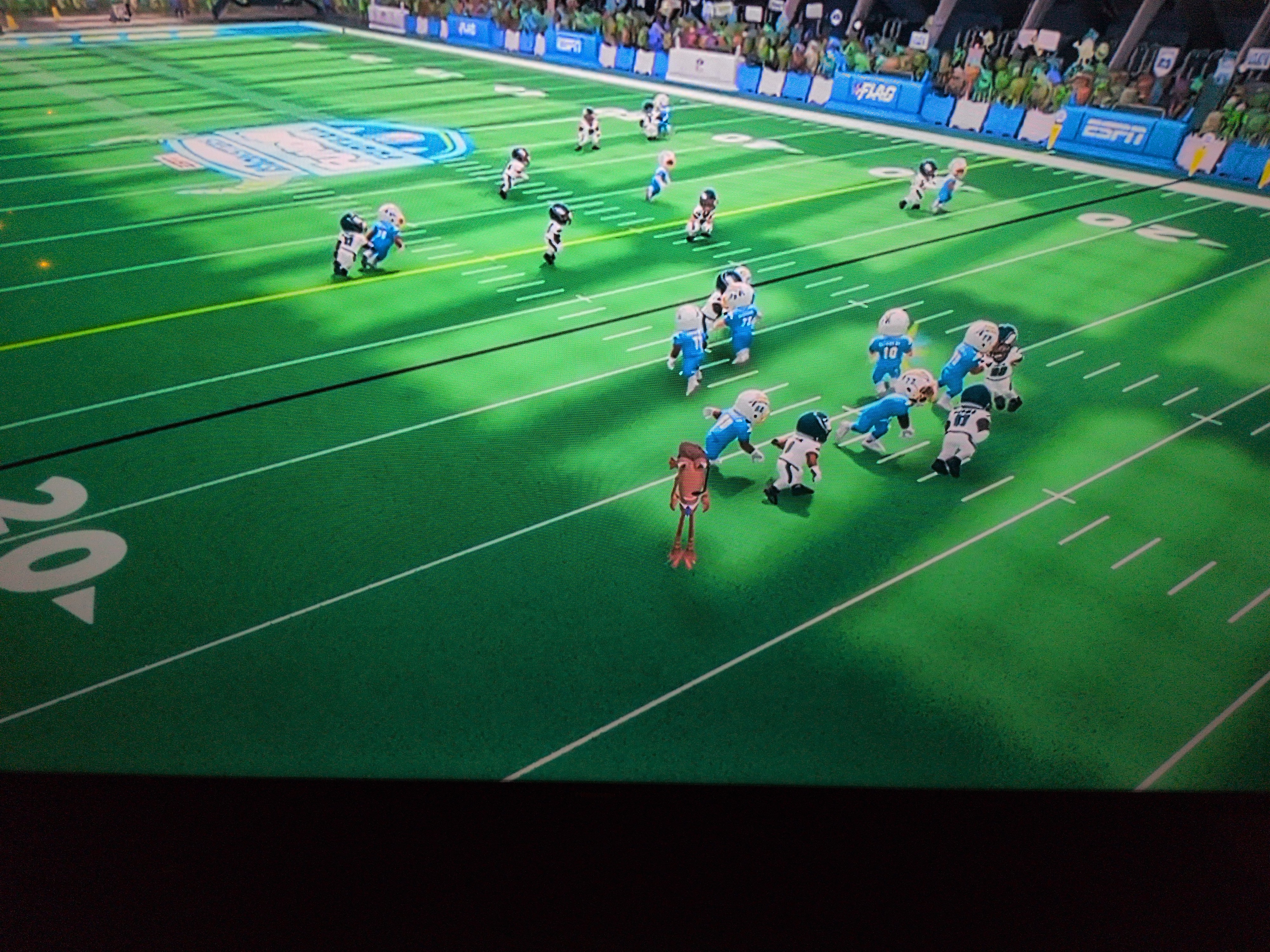 a screenshot of ESPN / Disney Monsters football broadcast 